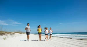 Family Jogging on the Beach